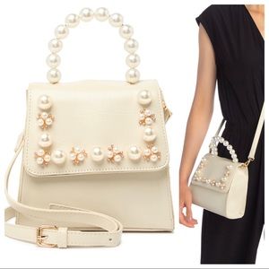 Pink Haley faux pearl and faux leather bag xbody.